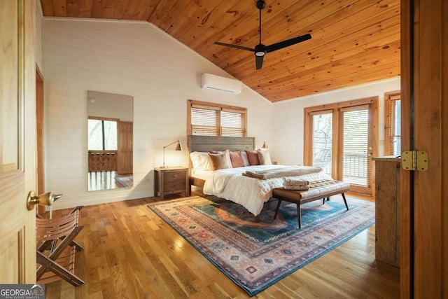 bedroom featuring a wall unit AC, wood walls, wood finished floors, wood ceiling, and vaulted ceiling