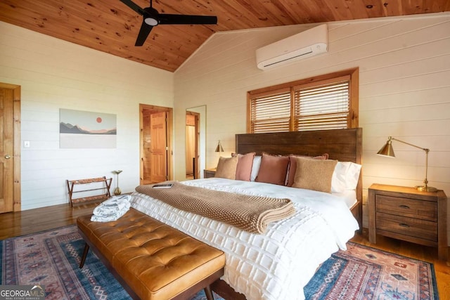 bedroom featuring a wall unit AC, wood walls, wood finished floors, wood ceiling, and vaulted ceiling