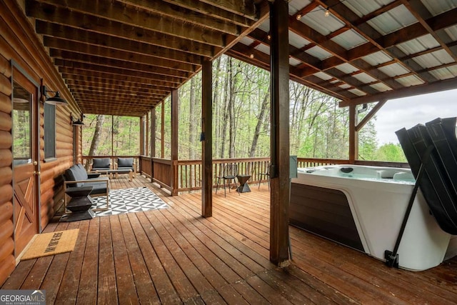 deck featuring a hot tub