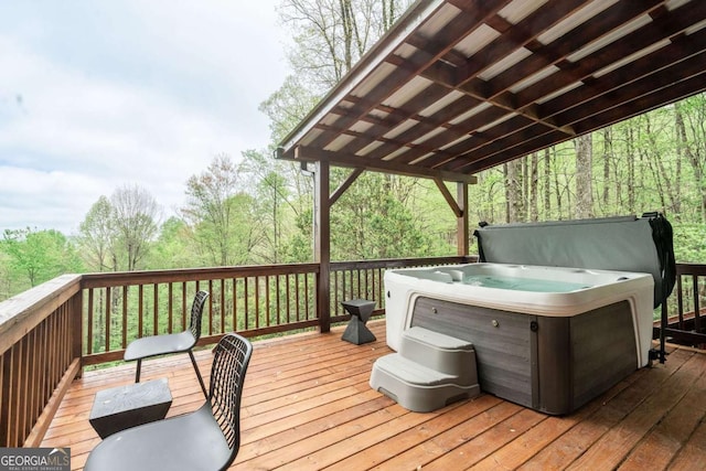 wooden deck featuring a hot tub