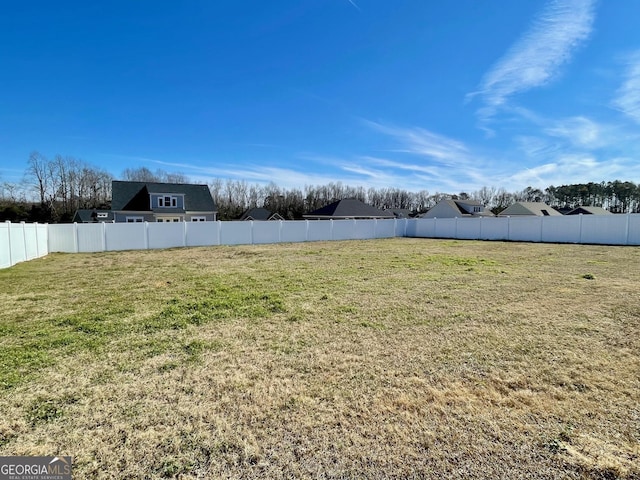 view of yard with a fenced backyard