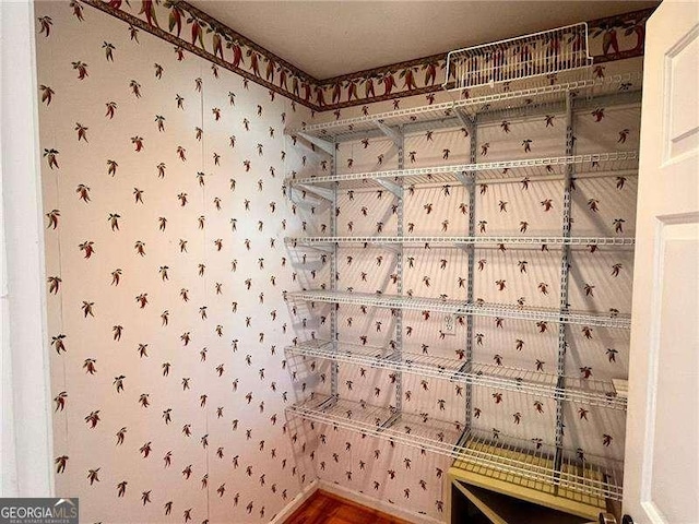 interior space with wallpapered walls