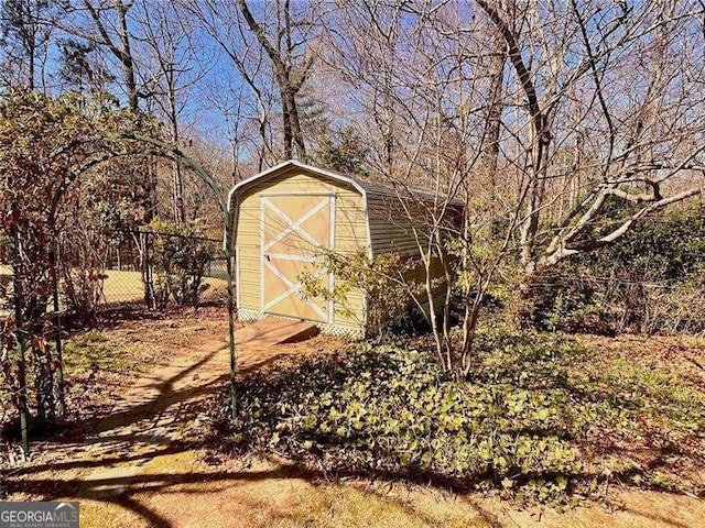 view of shed with fence