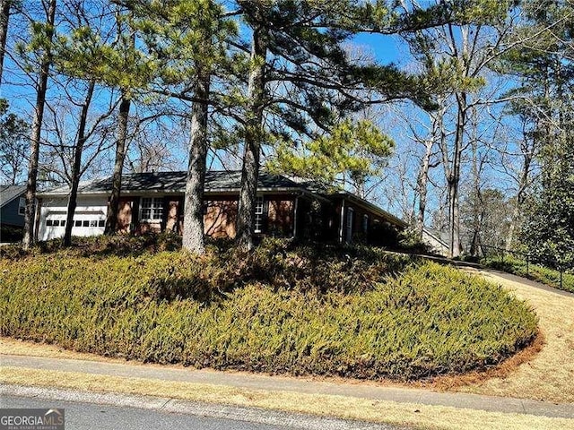 view of side of property featuring a garage