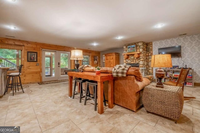 living room with recessed lighting and wallpapered walls