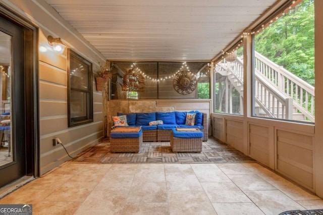 sunroom / solarium featuring wooden ceiling