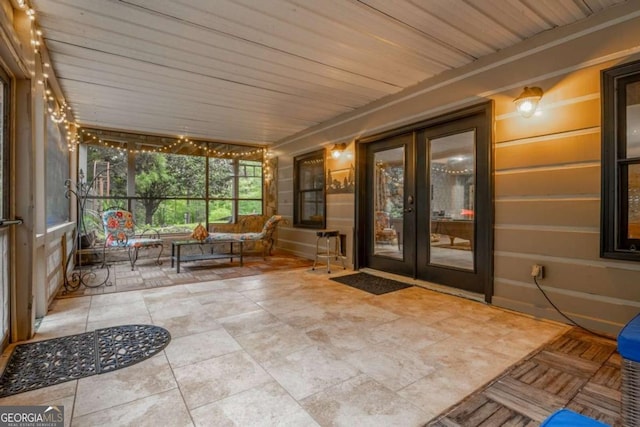 unfurnished sunroom with french doors and wood ceiling