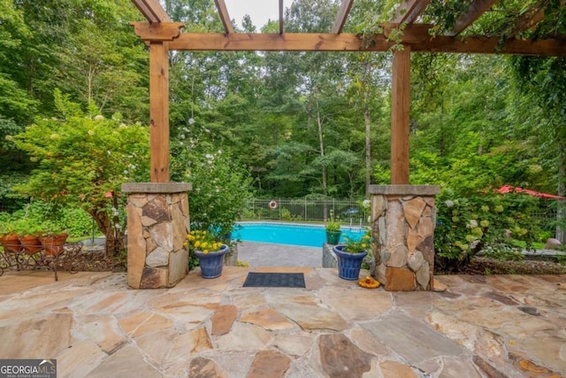 view of swimming pool with a fenced in pool, a patio area, fence, and a pergola