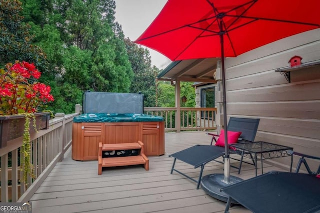 wooden deck with a hot tub