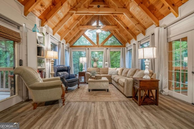 sunroom / solarium with vaulted ceiling with beams and wooden ceiling