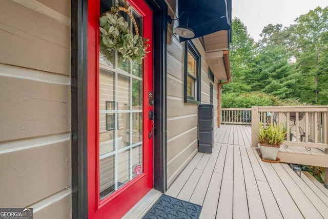 property entrance with a wooden deck