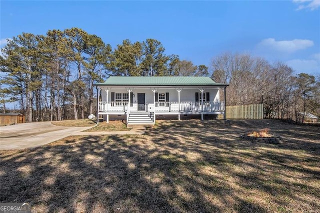 view of front of house with a porch and crawl space