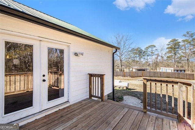 wooden terrace with french doors and fence