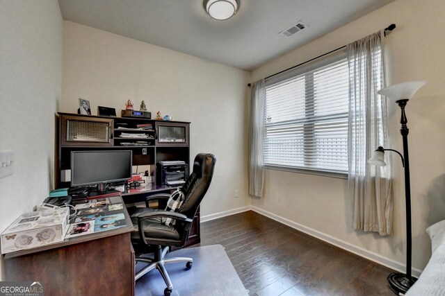 bathroom with double vanity, a walk in shower, visible vents, and a sink