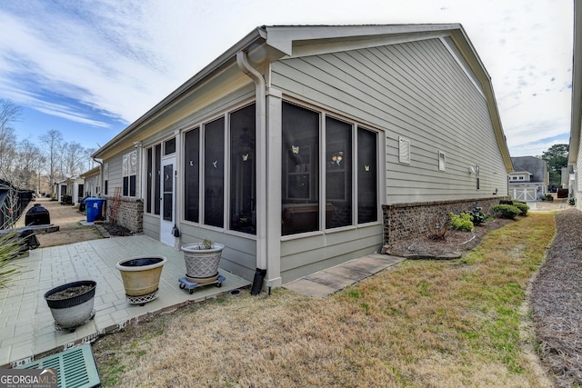 craftsman inspired home featuring an attached garage, driveway, and brick siding