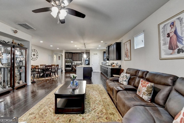 office featuring wood-type flooring, baseboards, and visible vents