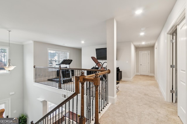 hallway with attic access, baseboards, an upstairs landing, carpet floors, and recessed lighting