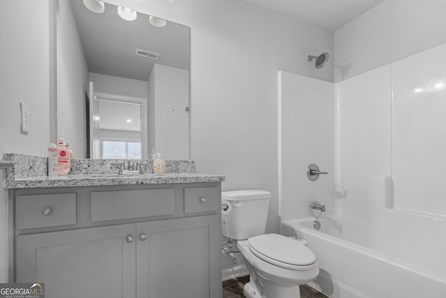 full bath featuring washtub / shower combination, visible vents, vanity, and toilet