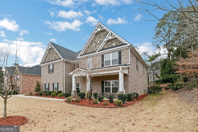 craftsman-style house featuring brick siding