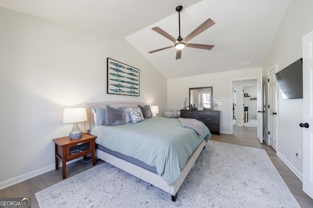 bedroom with baseboards, visible vents, a ceiling fan, wood finished floors, and vaulted ceiling