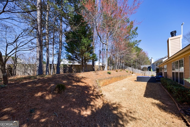 view of yard with a fenced backyard