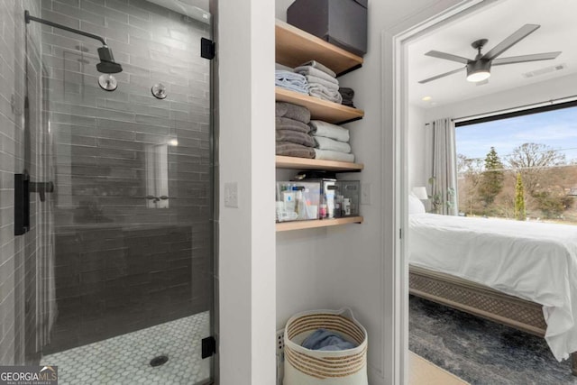 full bathroom with a shower stall, visible vents, ceiling fan, and ensuite bathroom