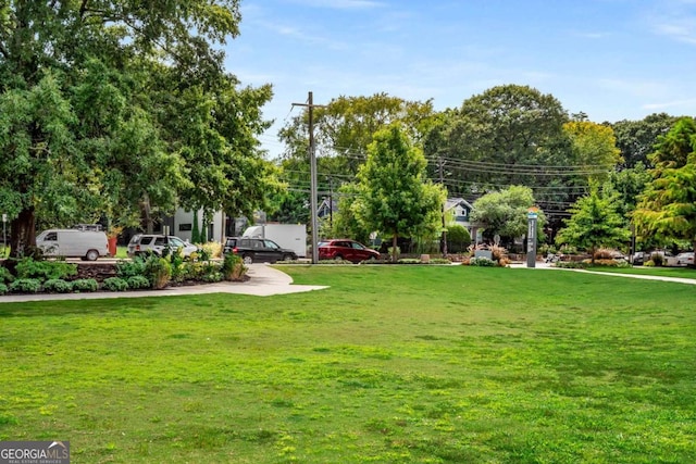 surrounding community featuring a lawn