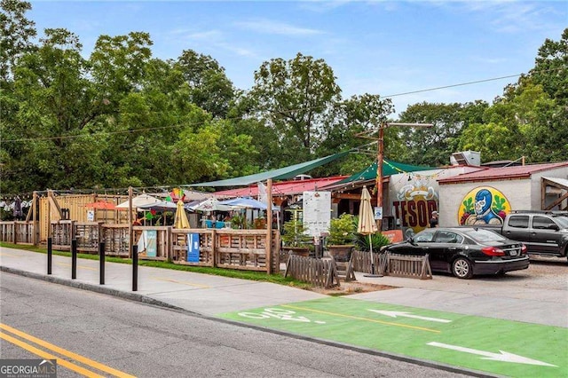 view of community featuring fence