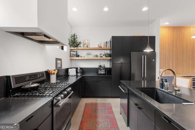 kitchen featuring a sink, appliances with stainless steel finishes, dark cabinetry, range hood, and modern cabinets