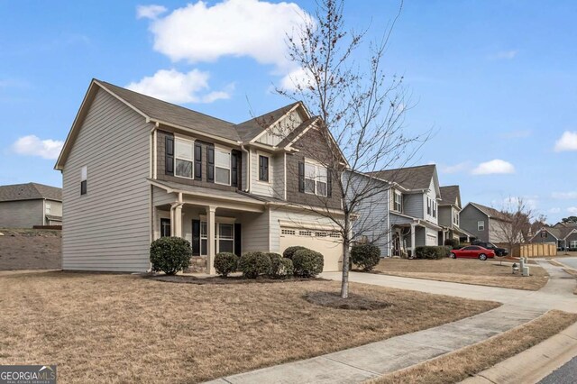 view of front of house featuring a residential view, concrete driveway, and an attached garage