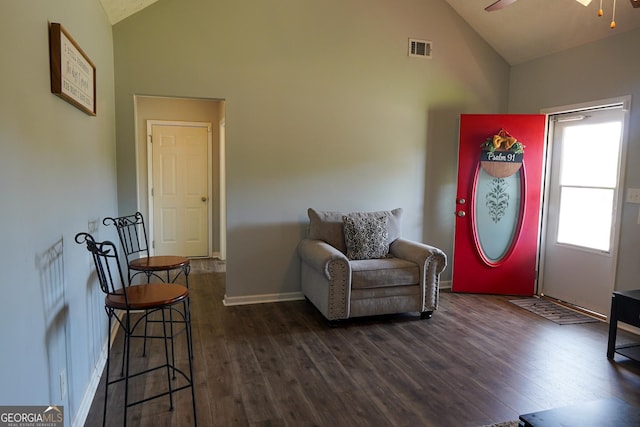 sitting room featuring visible vents, dark wood-type flooring, a ceiling fan, and baseboards