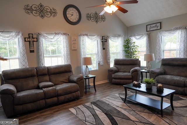 living room with high vaulted ceiling, a wealth of natural light, a ceiling fan, and wood finished floors