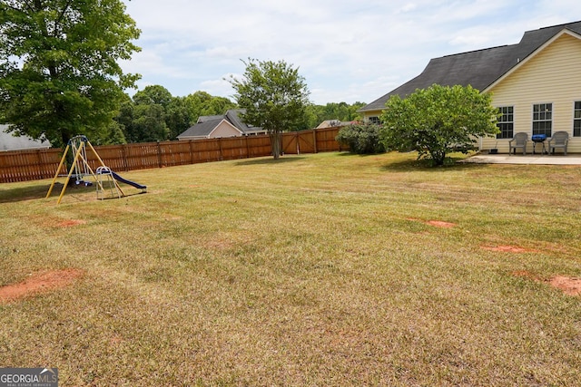 view of yard featuring a patio area and a fenced backyard