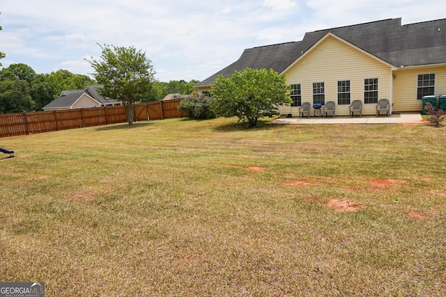 view of yard with a patio and fence