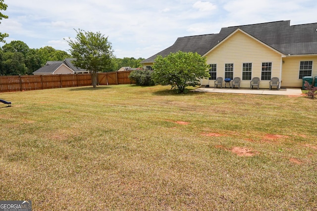 view of yard with a patio and fence