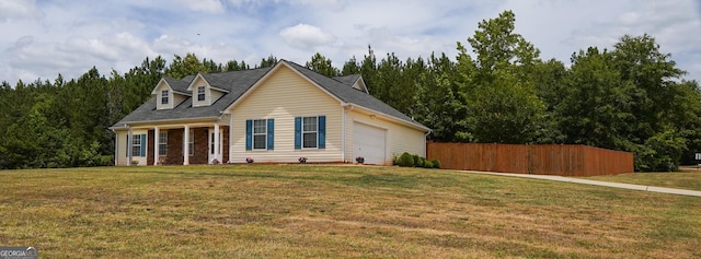 view of front of home with fence and a front yard