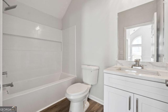 full bath featuring visible vents, toilet, wood finished floors, vaulted ceiling, and vanity