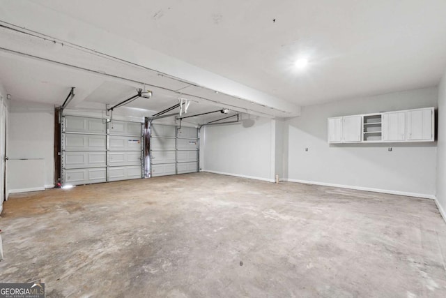 garage featuring baseboards