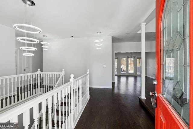 hall featuring french doors, baseboards, an upstairs landing, and wood finished floors