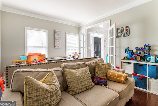 living area with ornamental molding and wood finished floors