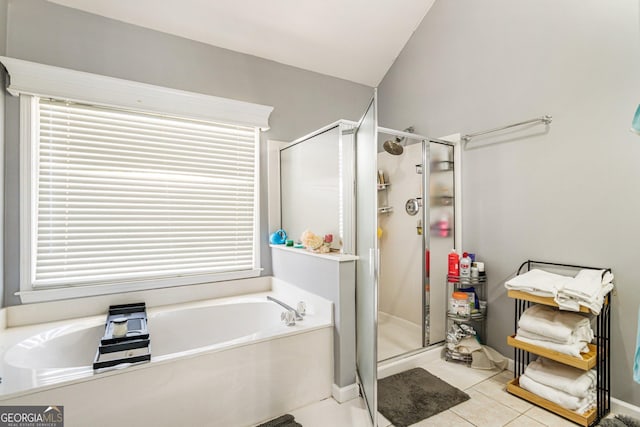 full bathroom with a stall shower, tile patterned flooring, and a garden tub