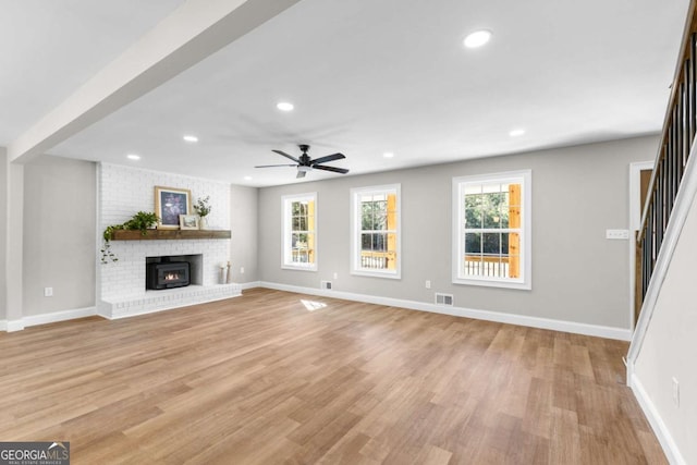 unfurnished living room featuring baseboards, recessed lighting, visible vents, and light wood-style floors