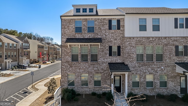 view of front of house featuring brick siding