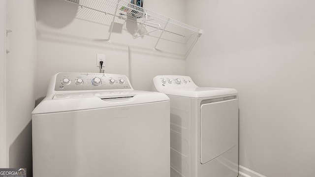 laundry area featuring laundry area and washing machine and clothes dryer