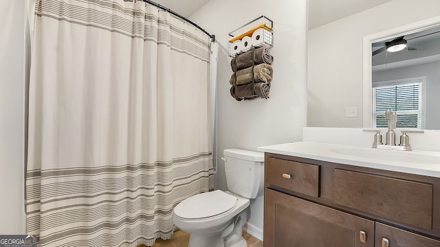 bathroom with toilet and vanity