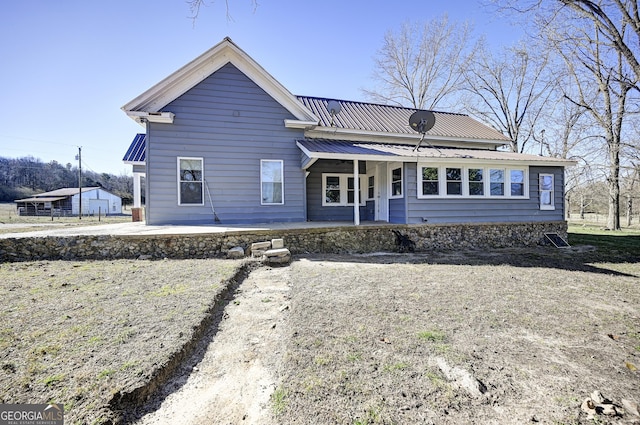 view of front of property featuring metal roof