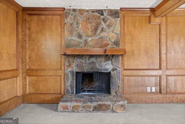 interior details featuring a stone fireplace