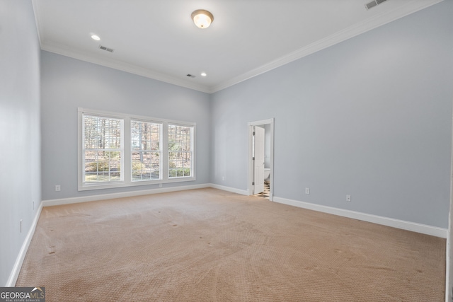 unfurnished room with recessed lighting, baseboards, light colored carpet, and ornamental molding