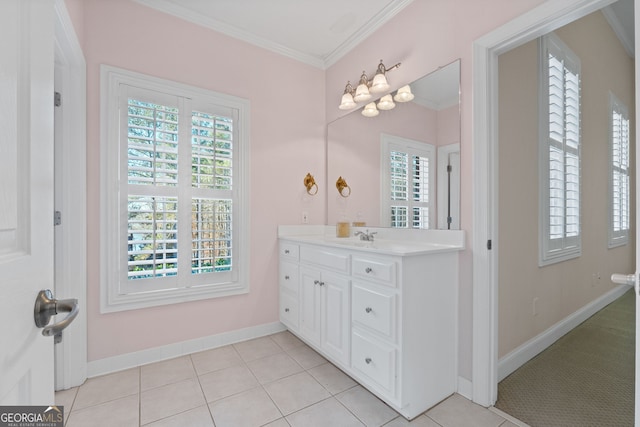 bathroom featuring tile patterned flooring, ornamental molding, baseboards, and vanity