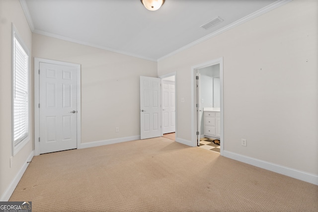 unfurnished bedroom with light carpet, baseboards, visible vents, and crown molding